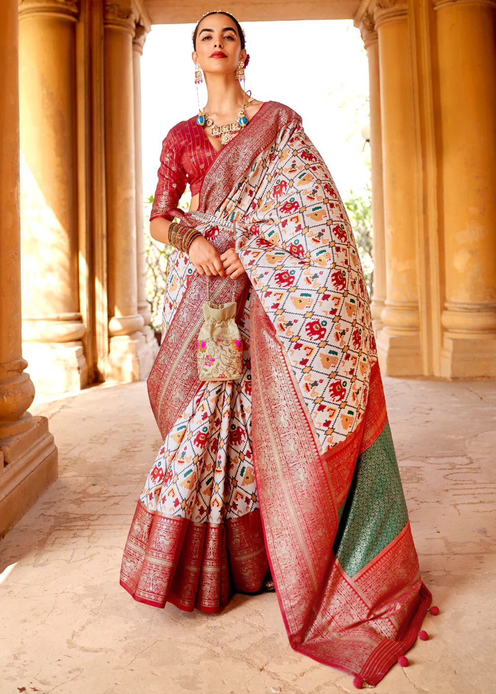 Elegant Off-White Patola Silk Saree with Red Border